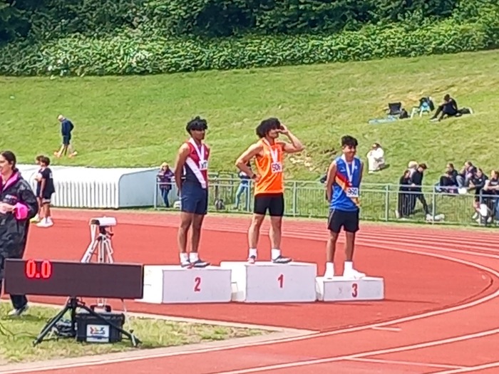 Level 3 Computing student Zayn on the podium